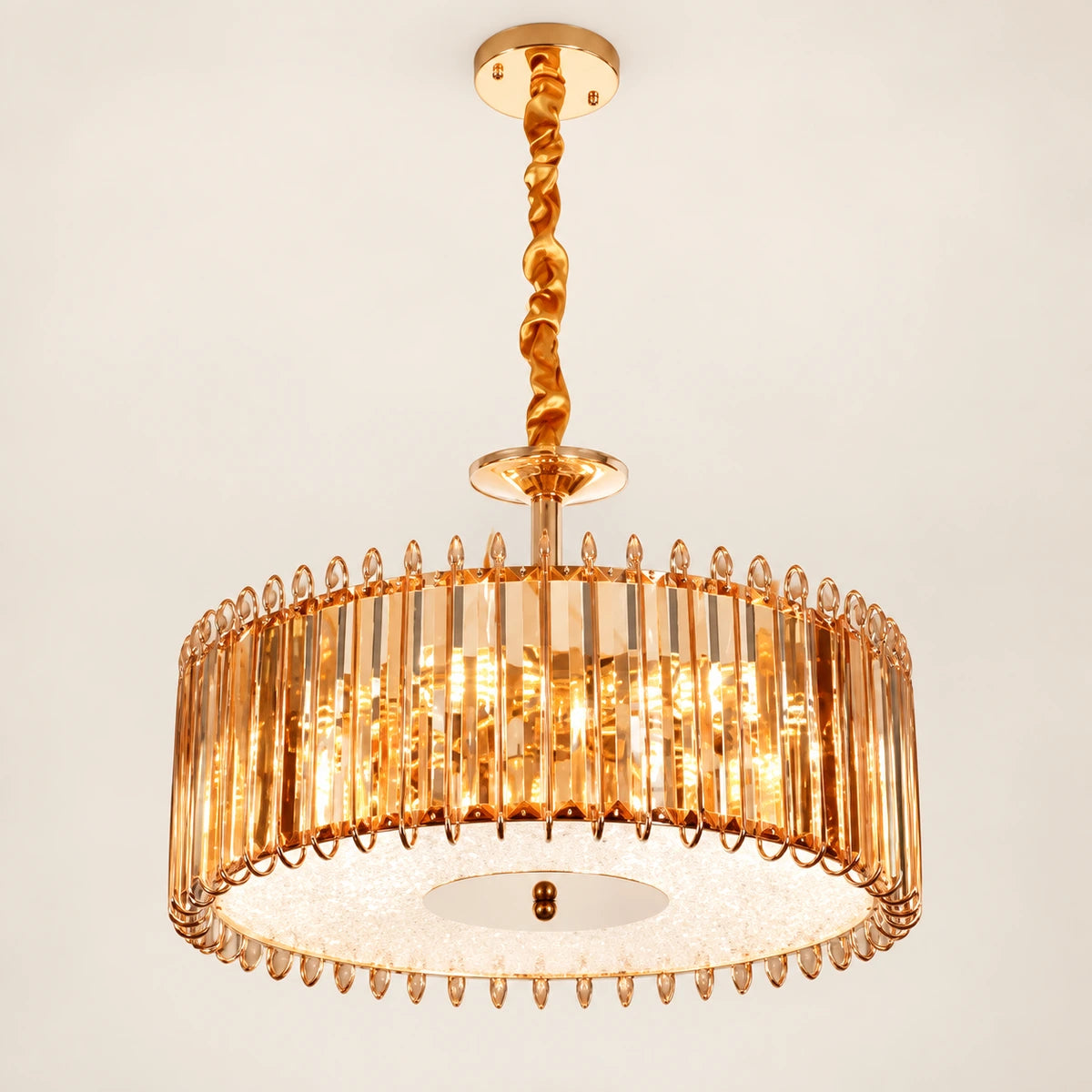 Amber crystal drum chandelier on a warm studio background