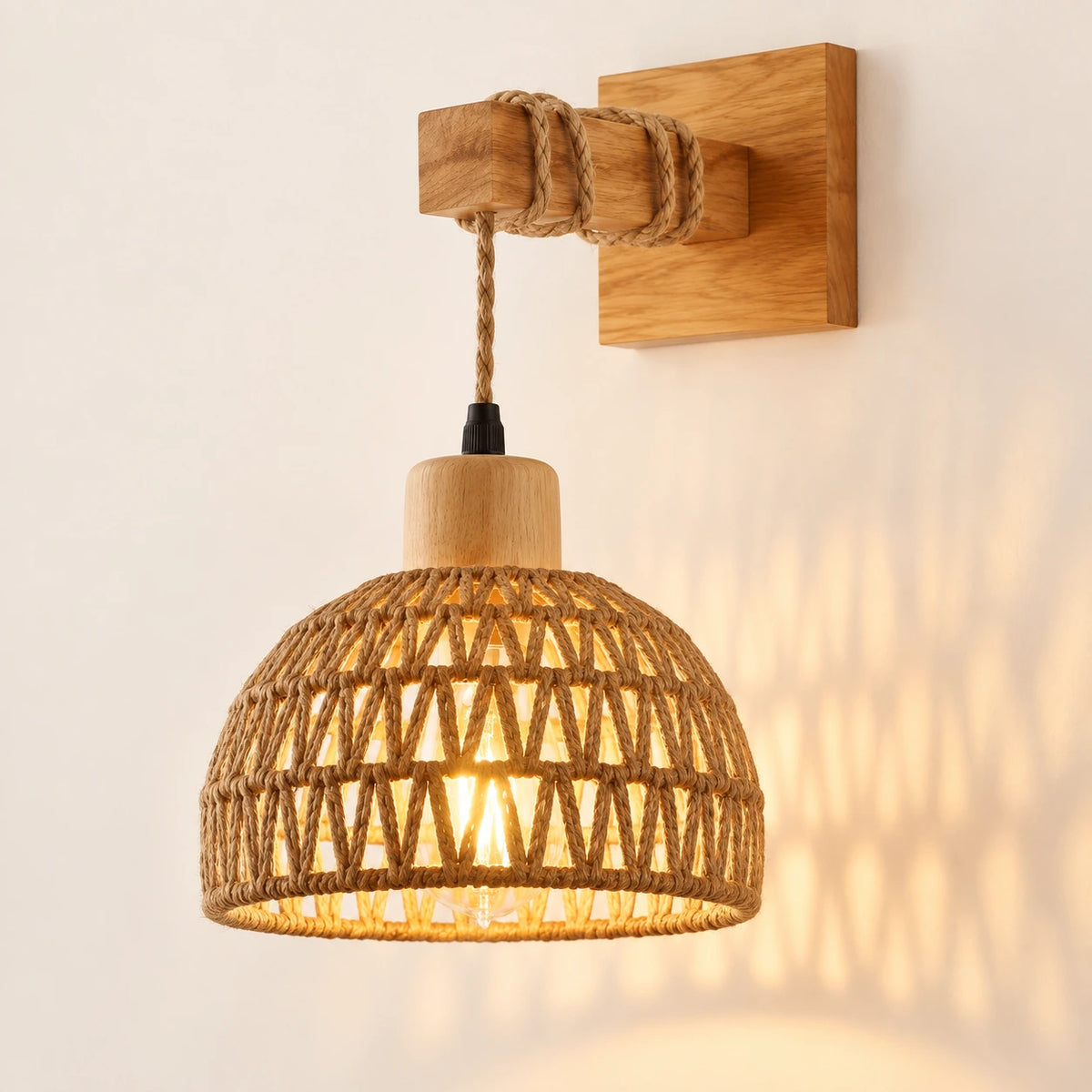 Woven dome shade wall sconce on a warm studio wall
