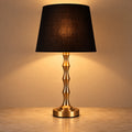 Copper-tone sculptural table lamp with black shade
