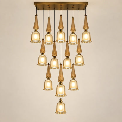 Thirteen-light amber glass cascade chandelier on a warm studio background