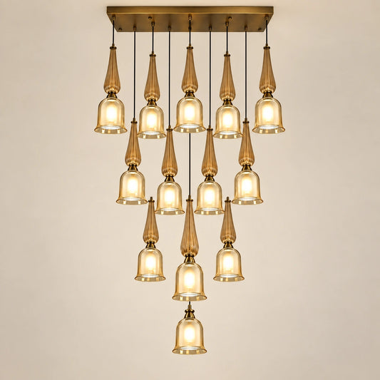 Thirteen-light amber glass cascade chandelier on a warm studio background
