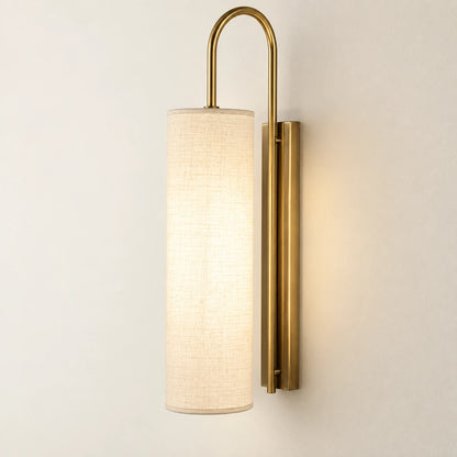 Tall cylinder shade wall sconce in ivory and warm brass tone