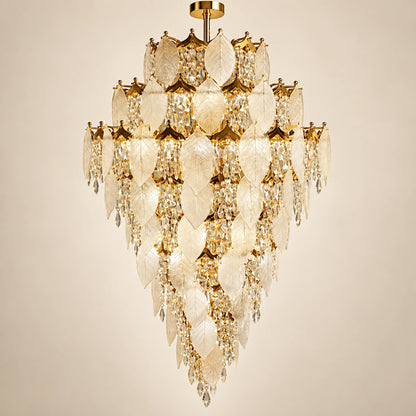 Grand frosted leaf double-height chandelier on a warm studio background
