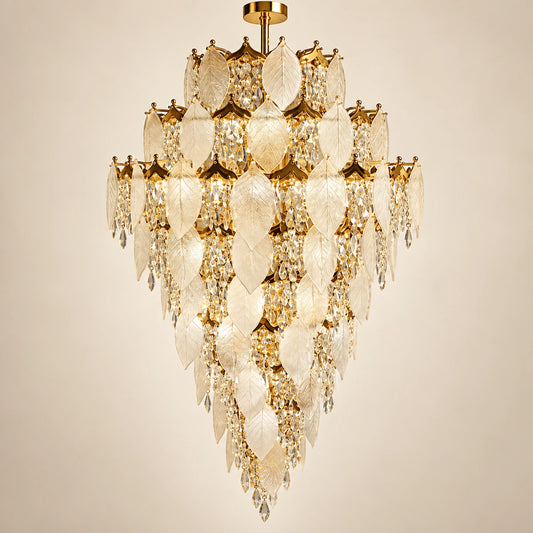 Grand frosted leaf double-height chandelier on a warm studio background