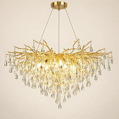 Gold branch crystal chandelier on a warm studio background