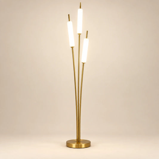 Gold-tone floor lamp with three staggered glowing white tubes