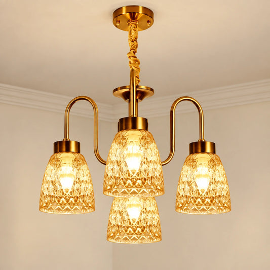 Four-light gold chandelier with patterned amber glass shades in a 3+1 arrangement
