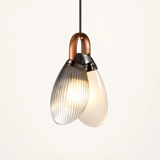 Double-glass teardrop pendant with copper loop and overlapping glass shells
