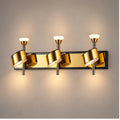 Gold three-head adjustable wall light
