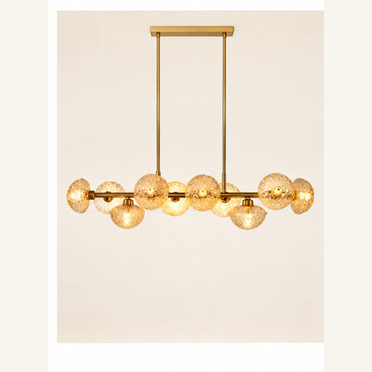 Gold and amber globe linear chandelier