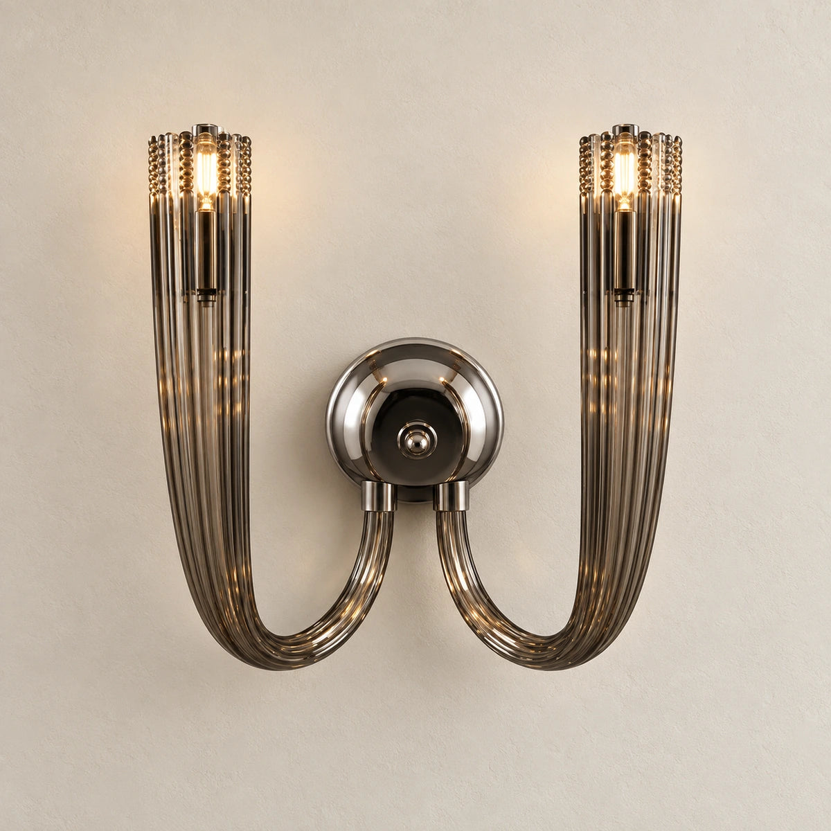 Twin-arm chrome wall sconce with two tall smoked-glass cylindrical shades