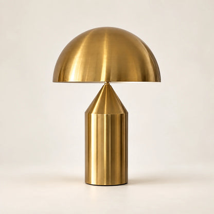 Antique-gold dome table lamp with broad metal shade and cylindrical base