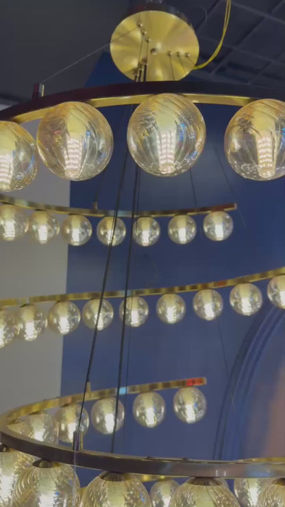 Spiral Amber Glass Chandelier – 69‑Light Dynamic Statement