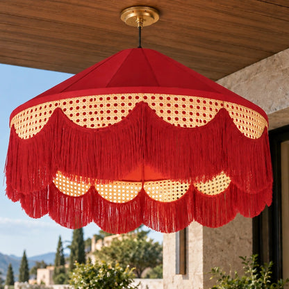 Deep-red cane fringe pendant on a covered patio