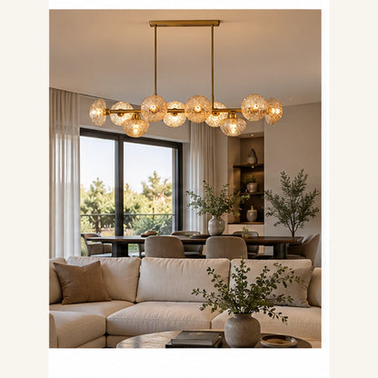 Gold amber globe chandelier in an open-plan room