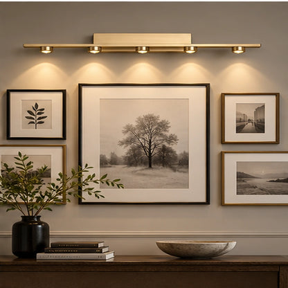 Five-light picture light in a gallery wall setting