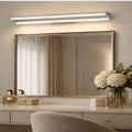 Illustrative room scene showing the Silver dual-bar mirror light above a mirror