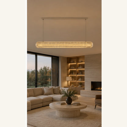 Clear acrylic linear pendant in an open-plan room