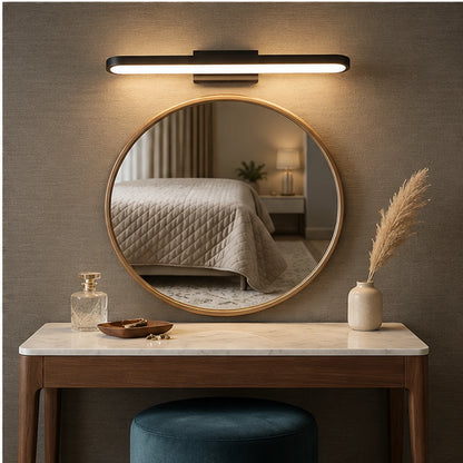 Rounded LED mirror light in a gallery wall setting