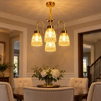 Four-light amber patterned-glass chandelier illuminating a dining area