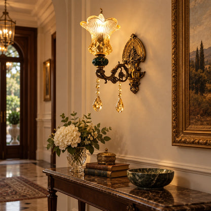 Green and amber floral glass wall sconce shown above a hallway console