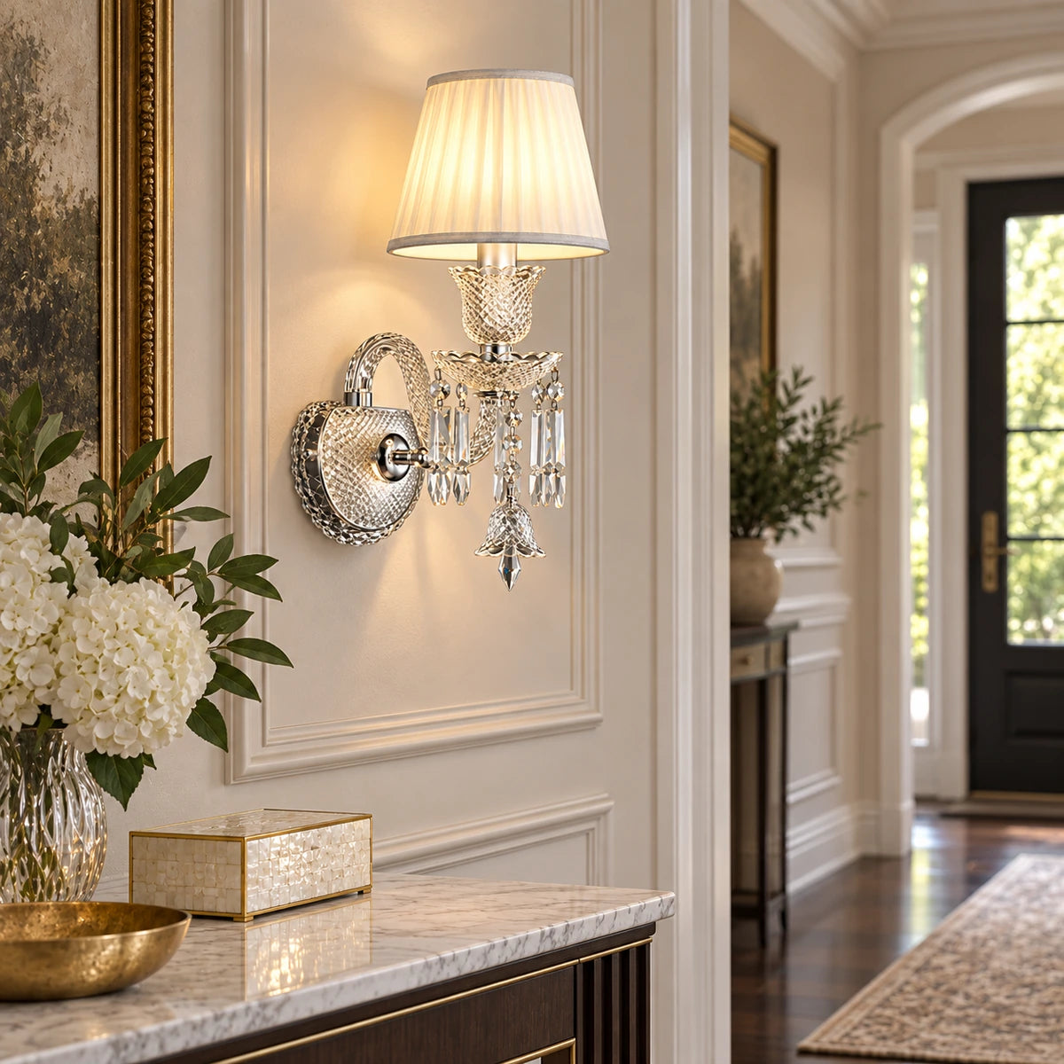 Crystal accent wall sconce illuminating a refined hallway