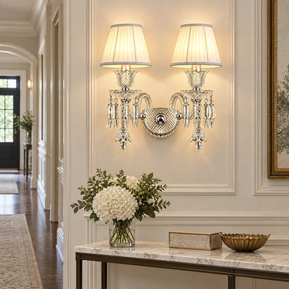Double-shade crystal wall sconce illuminating a refined hallway