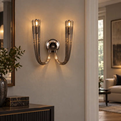 Twin-arm smoked-glass wall sconce illuminating a hallway