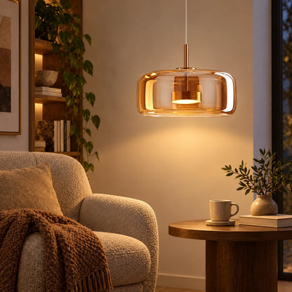 Amber glass capsule pendant in a living room reading corner