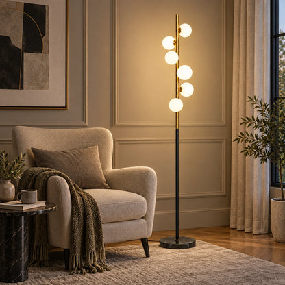 Milky globe column floor lamp beside a reading chair