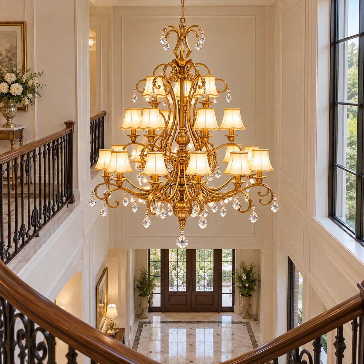 Three-tier chandelier suspended through a double-height stairwell void