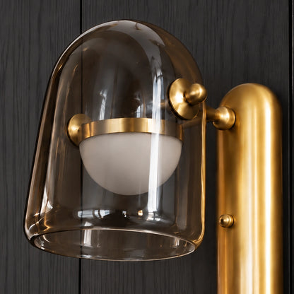 Close-up of smoked glass dome, opal diffuser and gold fittings
