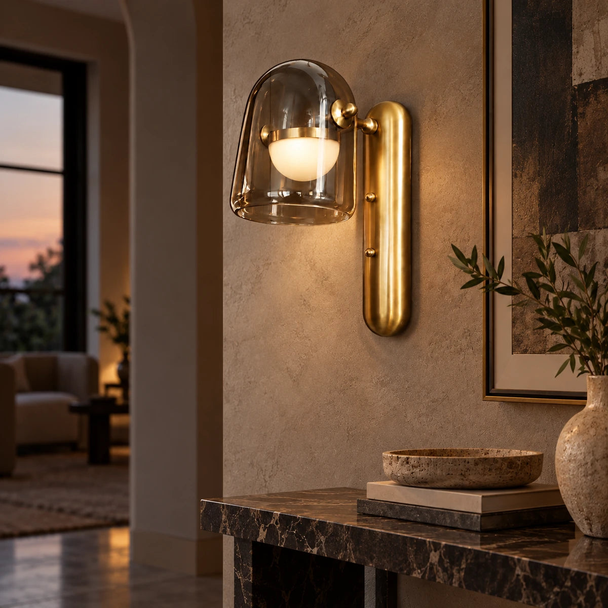 Smoked glass and brushed-gold wall light in a hallway