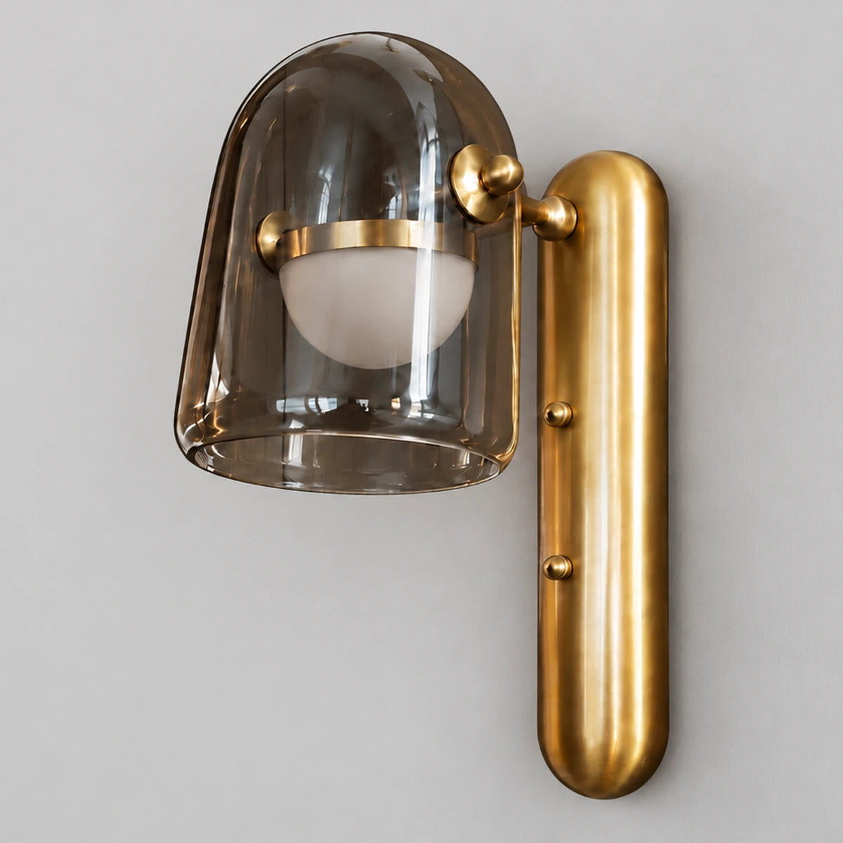 Smoked glass and brushed-gold capsule wall light