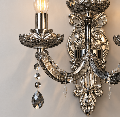 Curved arm, patterned cup and hanging accents