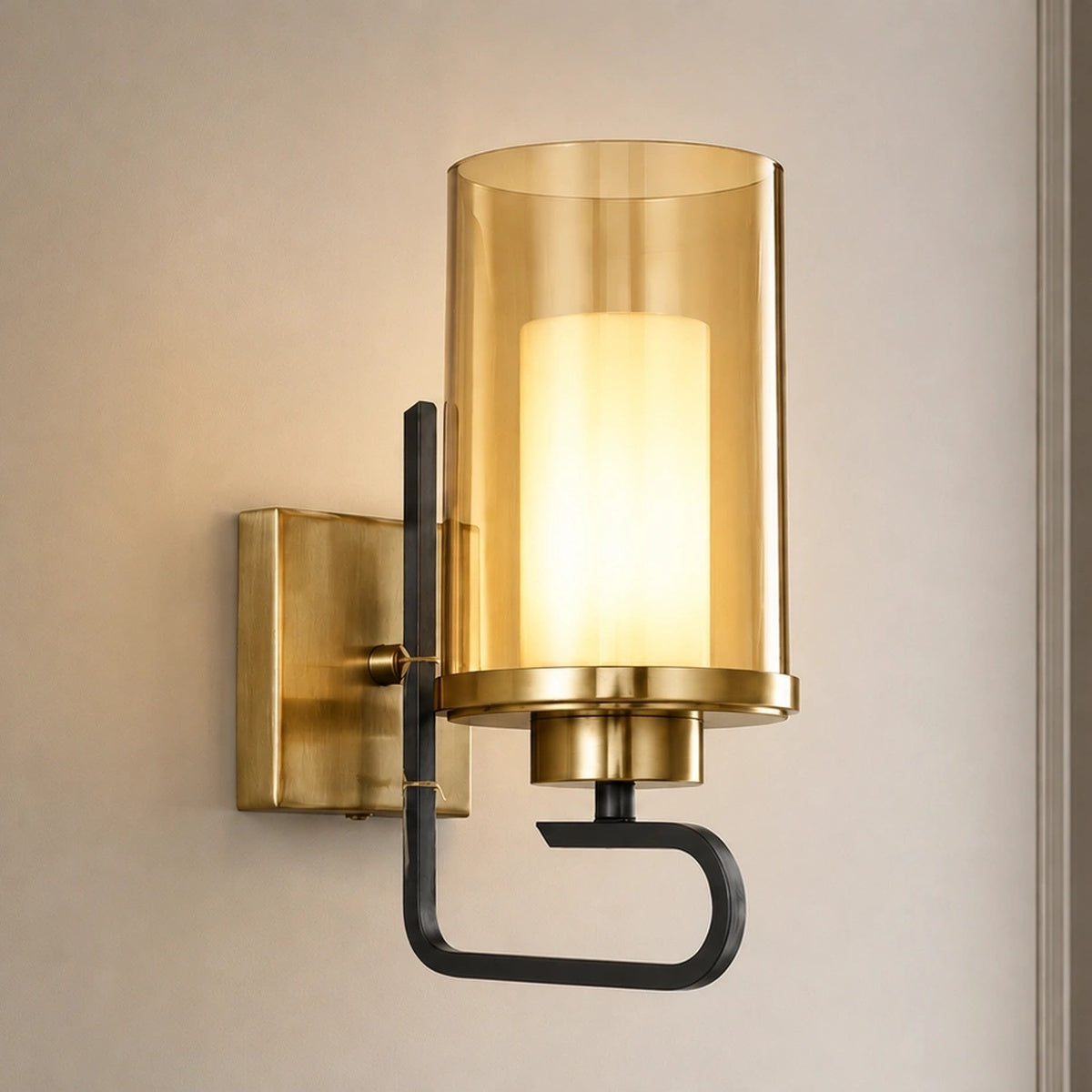 Aurelia amber-cylinder wall sconce illuminated beside a bright window