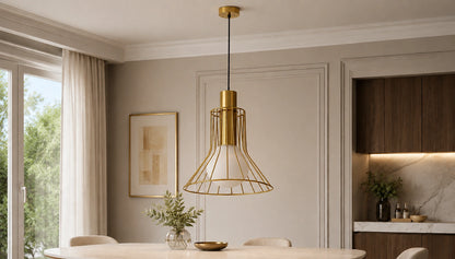 Solenne gold wire pendant above a contemporary dining table by day
