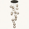 Cascading smoke glass globe chandelier on a clean studio background