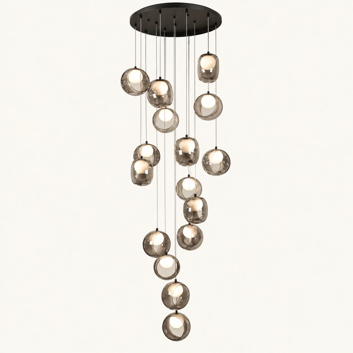 Cascading smoke glass globe chandelier on a clean studio background