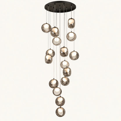 Cascading smoke glass globe chandelier on a clean studio background