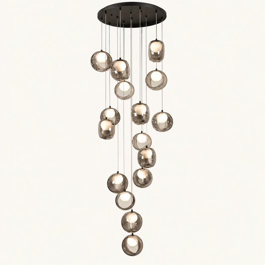 Cascading smoke glass globe chandelier on a clean studio background