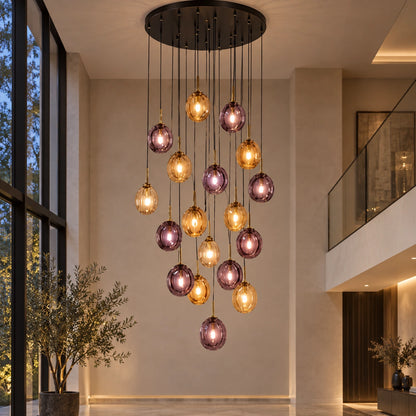 Amber and smoke glass globe cascade chandelier in a double-height interior