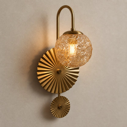 Textured globe fan wall light on a warm neutral background