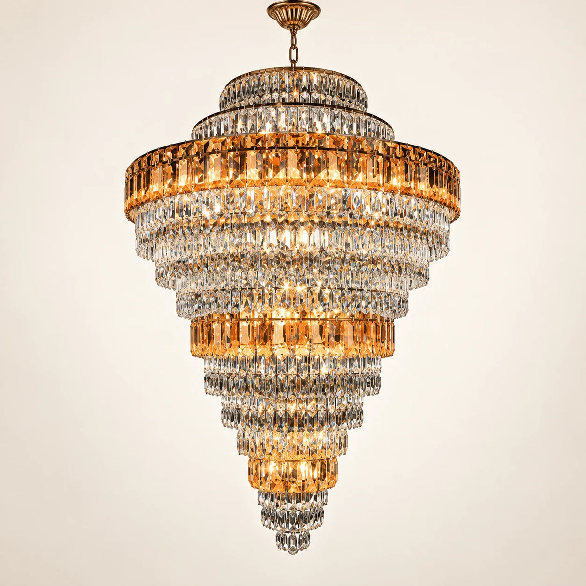 Tiered amber crystal chandelier on a clean studio background