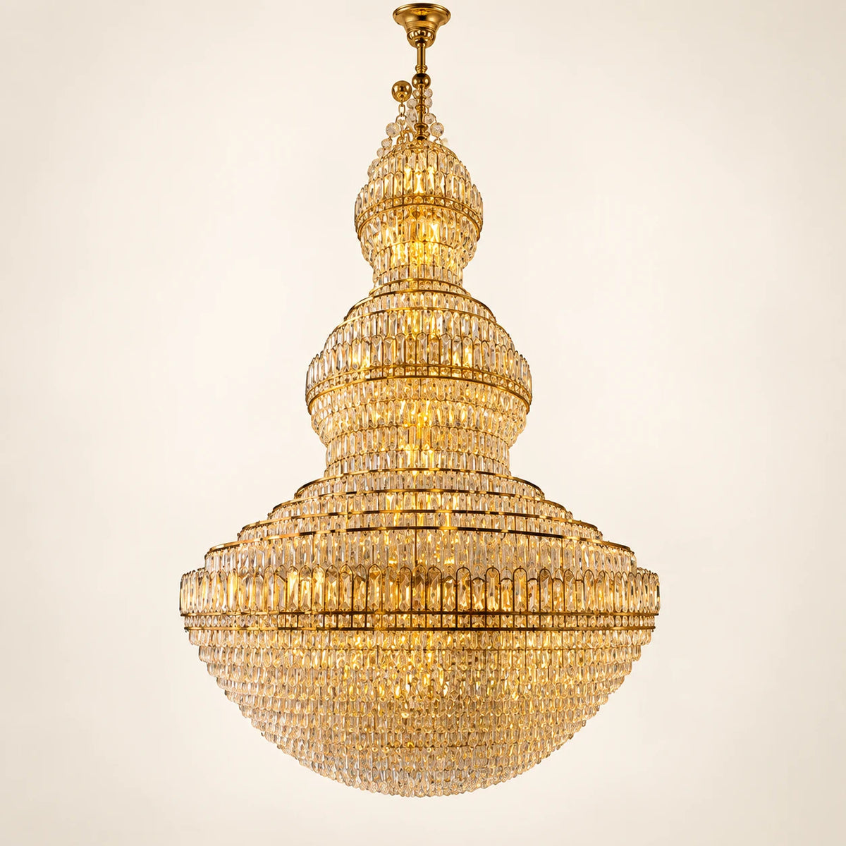 Grand tiered dome crystal chandelier on a clean studio background