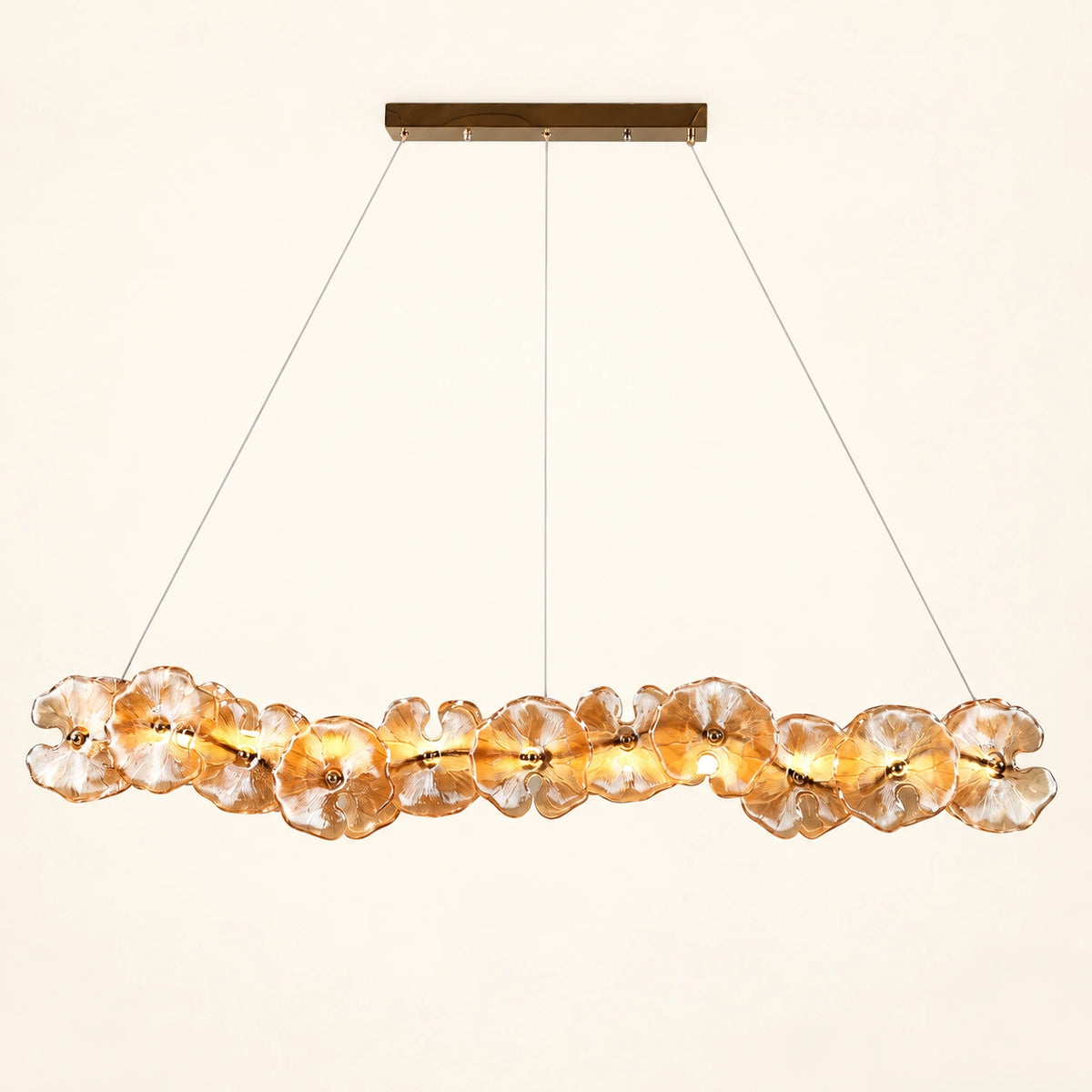 Floral glass linear pendant on a warm ivory background