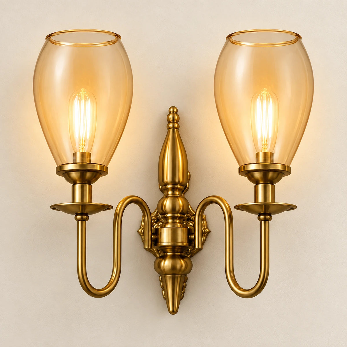 Twin amber tulip-shade wall sconce on a clean ivory background
