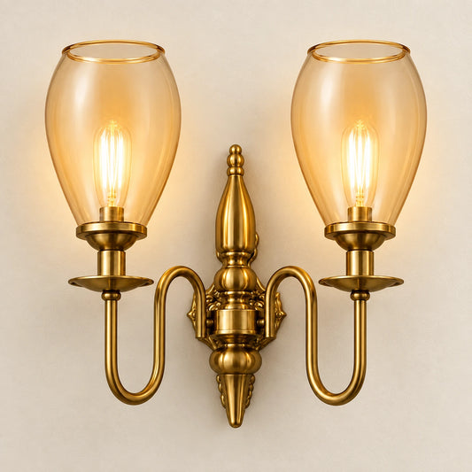 Twin amber tulip-shade wall sconce on a clean ivory background