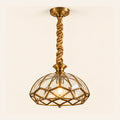Faceted antique cage pendant on a warm studio background