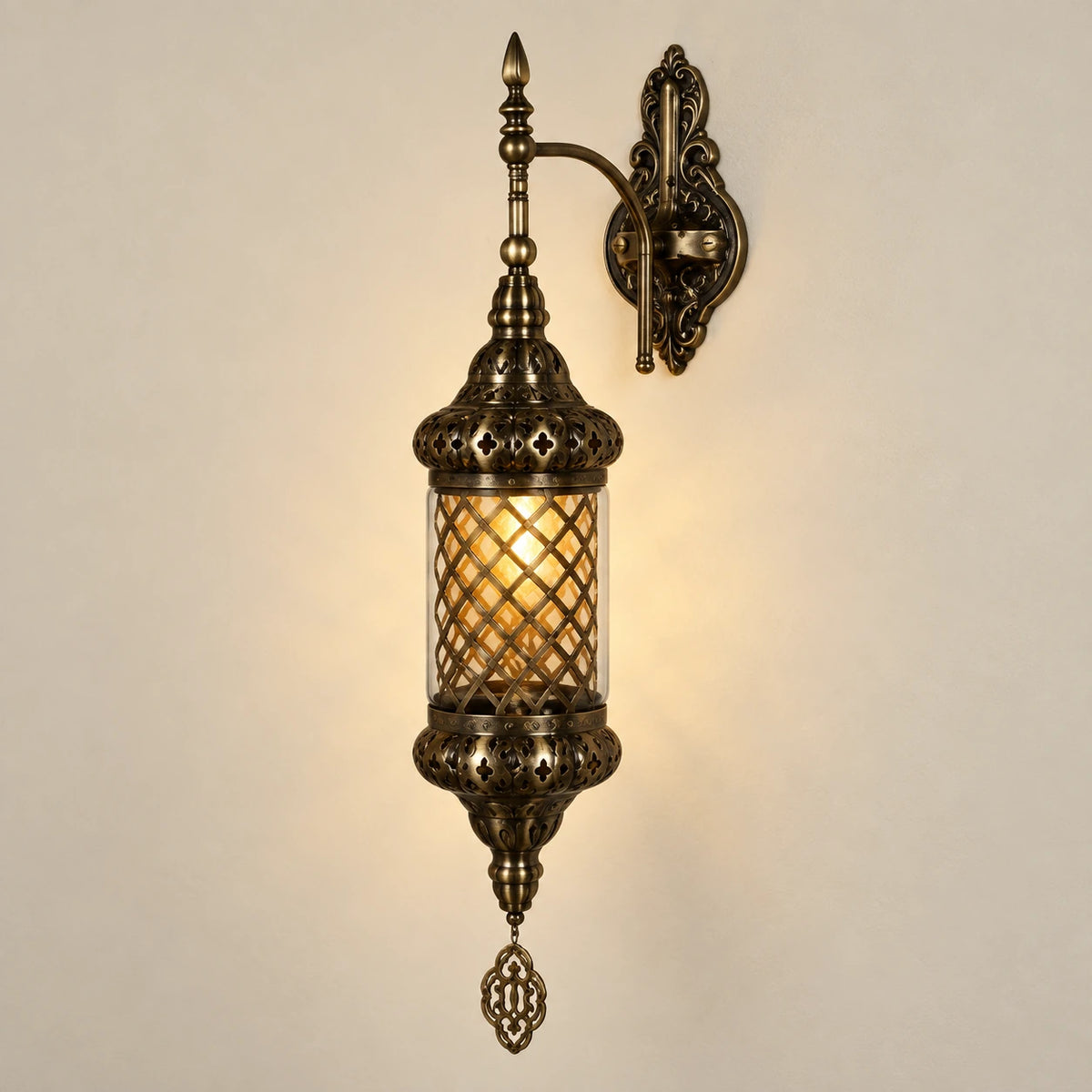 Antique mesh-globe wall sconce on a warm neutral background